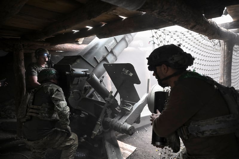 Artillerymen of the Special Rifle Police Battalion fire a D-30 howitzer towards Russian troops, at a position, amid Russia's attack on Ukraine, near the frontline town of Druzhkivka, in Donetsk region, Ukraine, August 27, 2026. REUTERS/Stringer