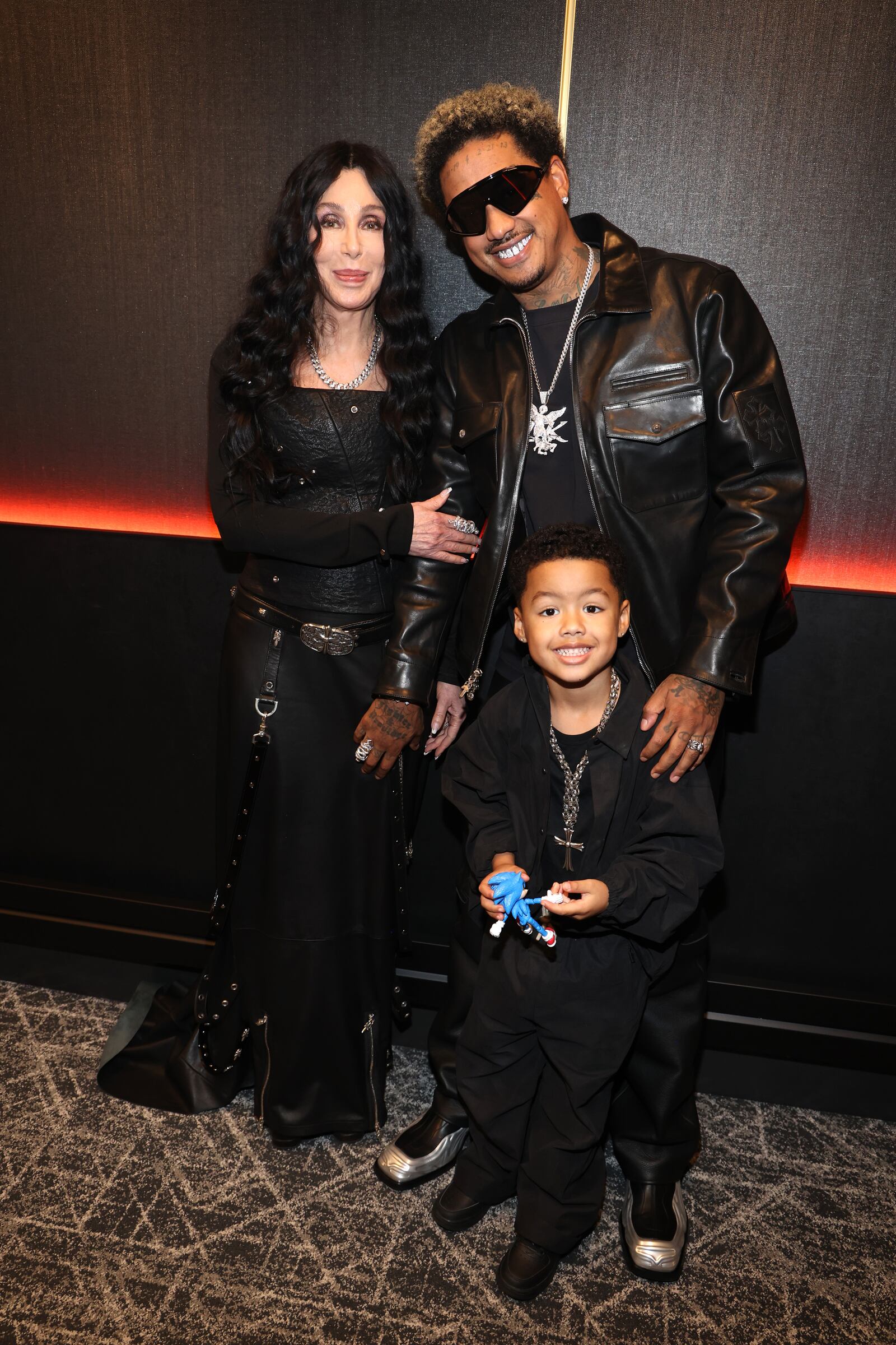 CLEVELAND, OHIO - OCTOBER 19: (L-R) Cher, Alexander "AE" Edwards and Slash Electric Alexander Edwards attend the 2024 Rock & Roll Hall Of Fame Induction Ceremony streaming on Disney+ at Rocket Mortgage Fieldhouse on October 19, 2024 in Cleveland, Ohio. (Photo by Kevin Mazur/Getty Images for The Rock and Roll Hall of Fame)