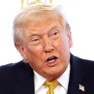 President Donald Trump calls service members on Christmas Eve at the Mar-a-Lago resort on December 24, 2025 in Palm Beach, Florida. Trump is spending the holidays in Florida this year.