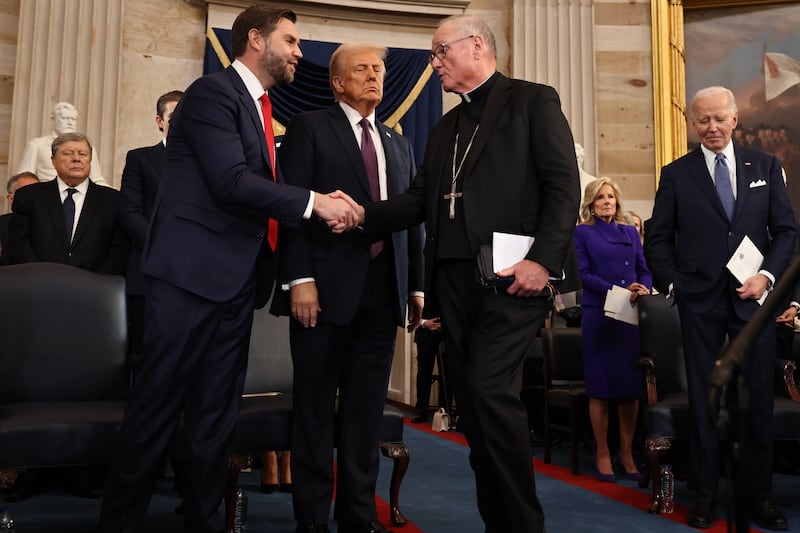 Vice President J.D. Vance and President Donald Trump greet Cardinal Timothy M. Dolan after he delivered the invocation during inauguration ceremonies in the Rotunda of the U.S. Capitol on January 20, 2025 in Washington, DC.