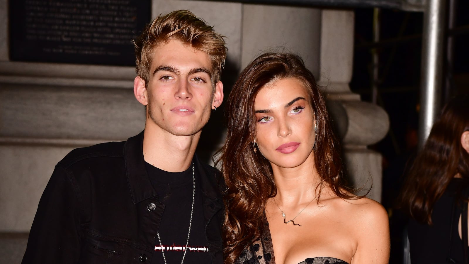 Presley Gerber and Charlotte D'Alessio pose for a picture at a formal event.