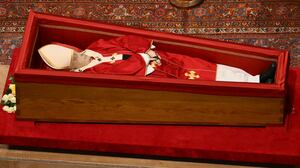 Pope Francis lies in state in a coffin at St. Peter's Basilica.