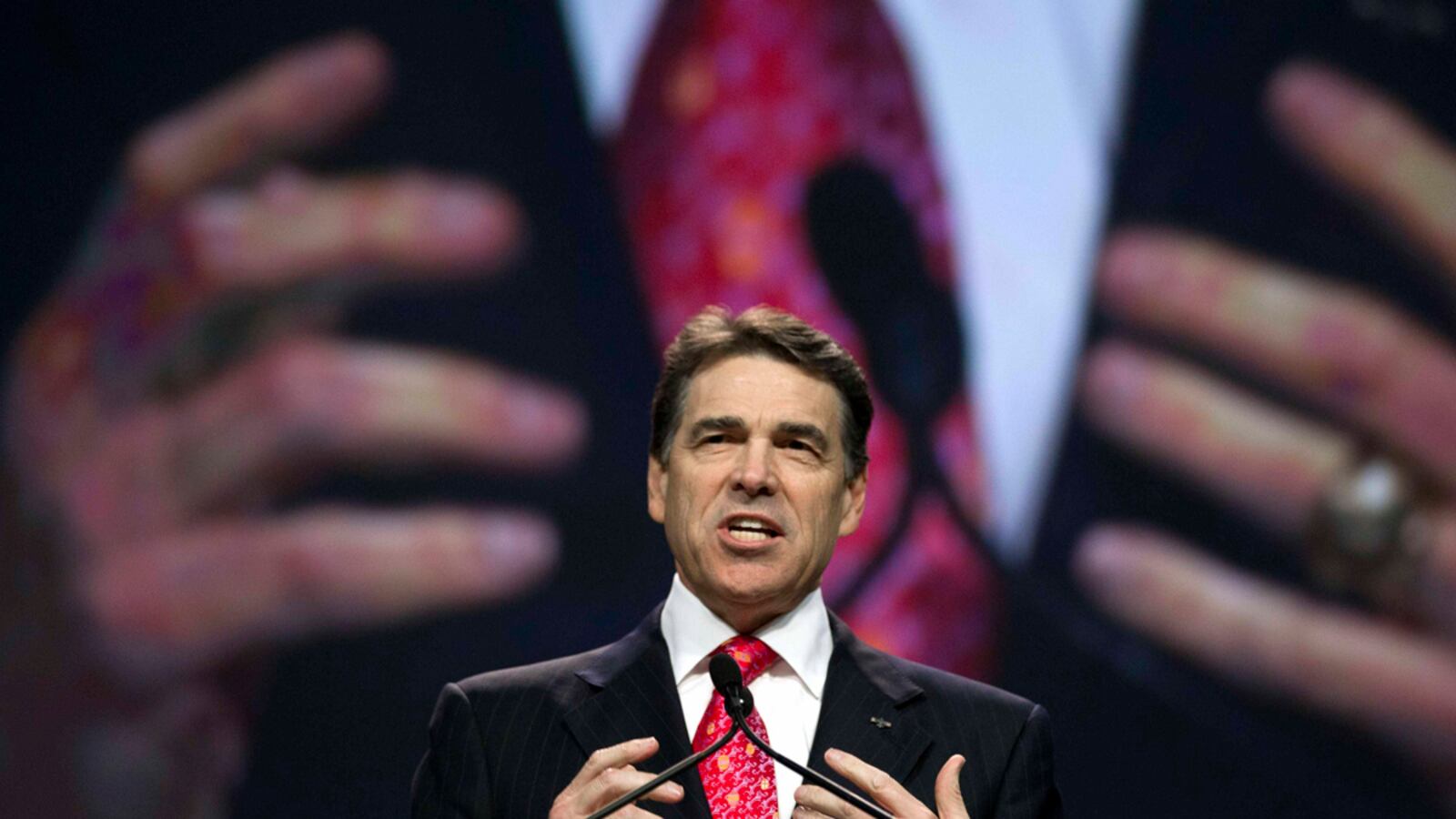 cheats/2011/08/21/perry-gives-state-aid-to-big-donors/rick-perry-hands-cheat_sqnkjk