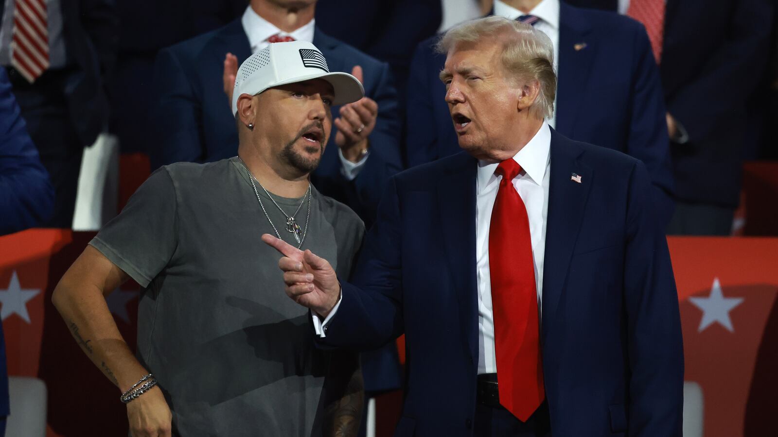 President Donald Trump speaks with country music artist Jason Aldean