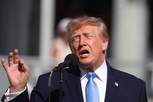 President Donald Trump addresses the gallery during the final round of the Presidents Cup.