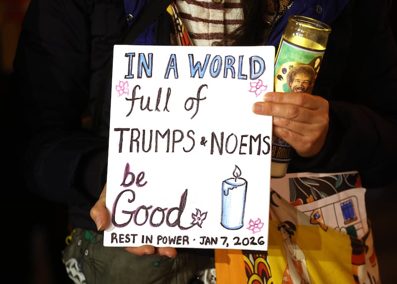Protesters take part in a vigil for Renee Nicole Good at Fruitvale Plaza in Oakland, Calif.,