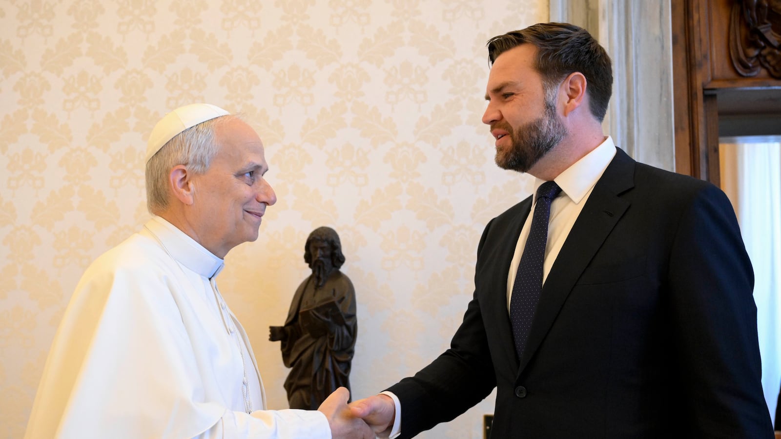 Pope Leo XIV shakes JD Vance's hand at the Vatican on May 19.