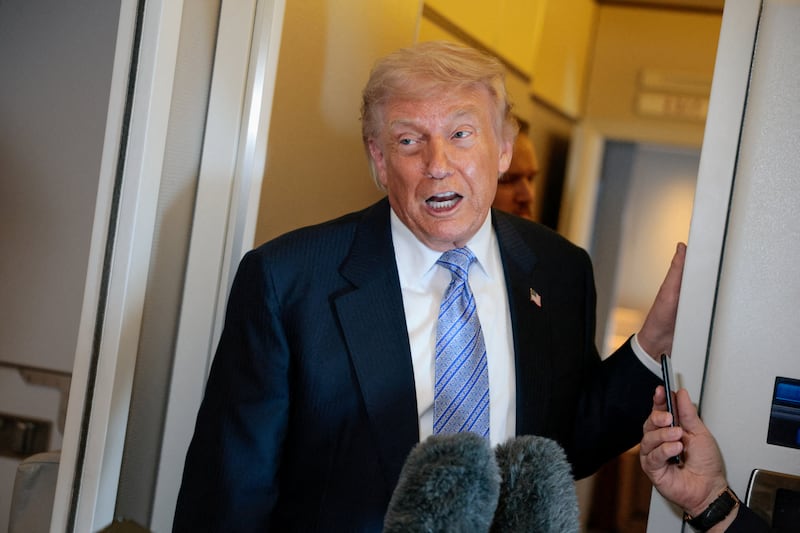 U.S. President Donald Trump speaks to the press aboard Air Force One en route to the U.S.  following his official visit with President Xi Jinping in China, May 15, 2026.