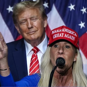 TOPSHOT - US Representative Marjorie Taylor Greene (R) speaks alongside former US President and 2024 presidential hopeful Donald Trump at a campaign event in Rome, Georgia, on March 9, 2024. (Photo by Elijah Nouvelage / AFP) (Photo by ELIJAH NOUVELAGE/AFP via Getty Images)