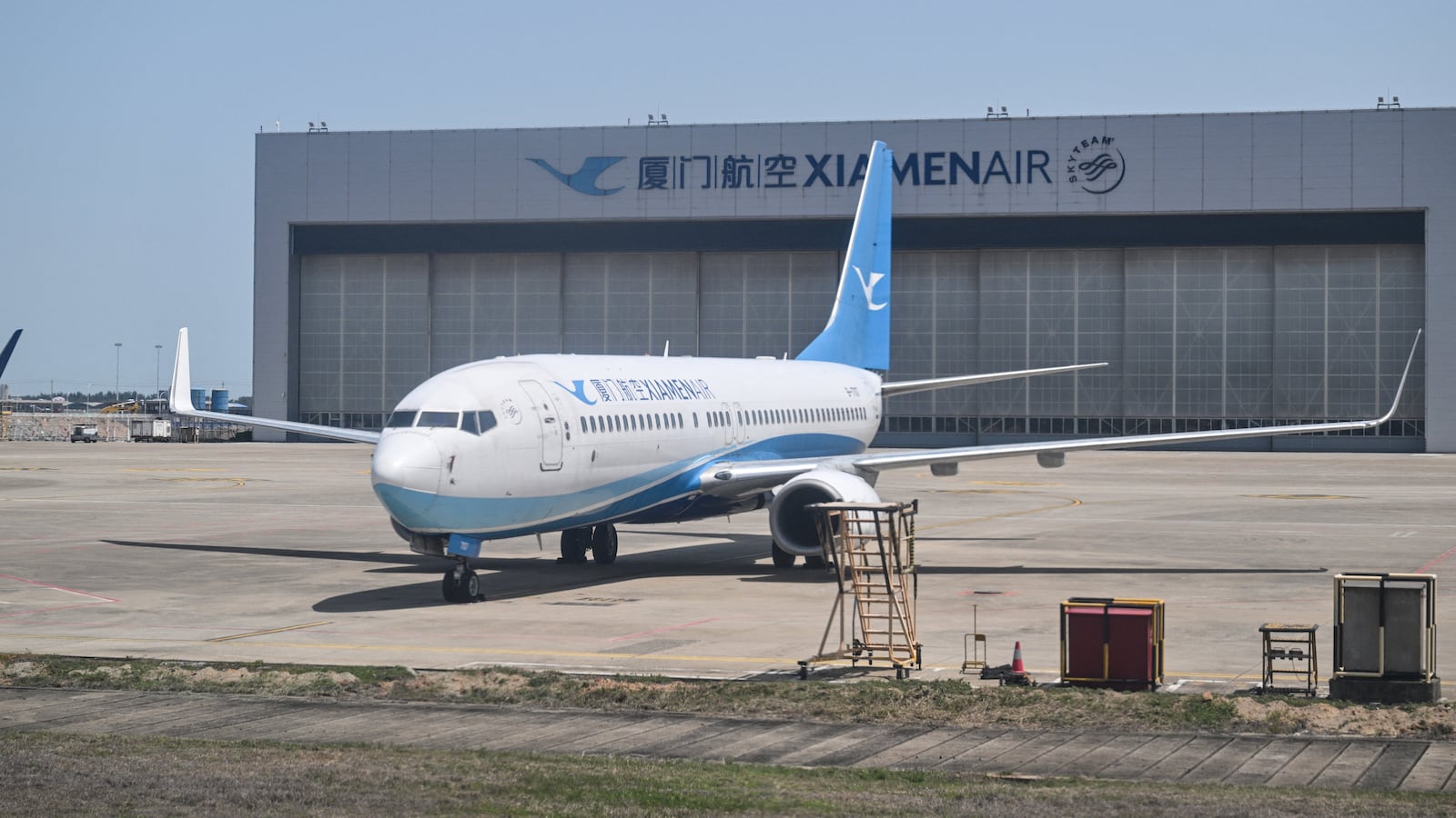 A Xiamen Airlines aircraft parked next to a hangar at Fuzhou Changle International Airport in Fuzhou, China, in April.