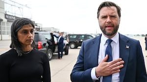 U.S. Vice President JD Vance speaks to the press as second lady Usha Vance looks on at Minneapolis Saint Paul International Airport after paying their respects to victims of the Annunciation Catholic Church shooting on September 3, 2025 in St Paul, Minnesota.