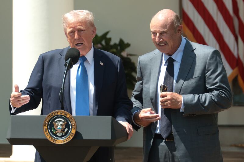 WASHINGTON, DC - MAY 01: U.S. President Donald Trump (L) speaks alongside Dr. Phil McGraw during a National Day of Prayer event in the Rose Garden at the White House on May 1, 2025 in Washington, DC. The National Day of Prayer is a congressionally recognized observance that calls on people of all faiths to participate in a day of prayer and reflection. (Photo by Alex Wong/Getty Images)