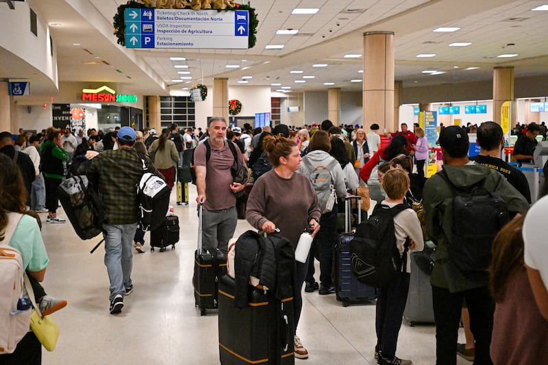 CORRECTION / Passengers wait at Luis Munoz Marin International Airport as all flights are cancelled following US military action in Venezuela, on January 3, 2026,  in Carolina, Puerto Rico. President Donald Trump said Saturday that US forces had captured Venezuelan leader Nicolas Maduro after launching a "large scale strike" on the South American country. "The United States of America has successfully carried out a large scale strike against Venezuela and its leader, President Nicolas Maduro, who has been, along with his wife, captured and flown out of the Country," Trump said on Truth Social. (Photo by Miguel J. Rodriguez Carrillo / AFP via Getty Images) / "The erroneous mention[s] appearing in the metadata of this photo by Miguel J. Rodriguez Carrillo has been modified in AFP systems in the following manner: [Luis Munoz Marin International Airport] instead of [José Aponte De la Torre Airport]. Please immediately remove the erroneous mention[s] from all your online services and delete it (them) from your servers. If you have been authorized by AFP to distribute it (them) to third parties, please ensure that the same actions are carried out by them. Failure to promptly comply with these instructions will entail liability on your part for any continued or post notification usage. Therefore we thank you very much for all your attention and prompt action. We are sorry for the inconvenience this notification may cause and remain at your disposal for any further information you may require."