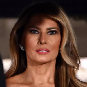 U.S. First Lady Melania Trump, accompanied by President Donald Trump, waits for the arrival of the Crown Prince and Prime Minister of the Kingdom of Saudi Arabia Mohammed bin Salman prior to a state dinner at the White House in Washington, DC on November 18, 2025.