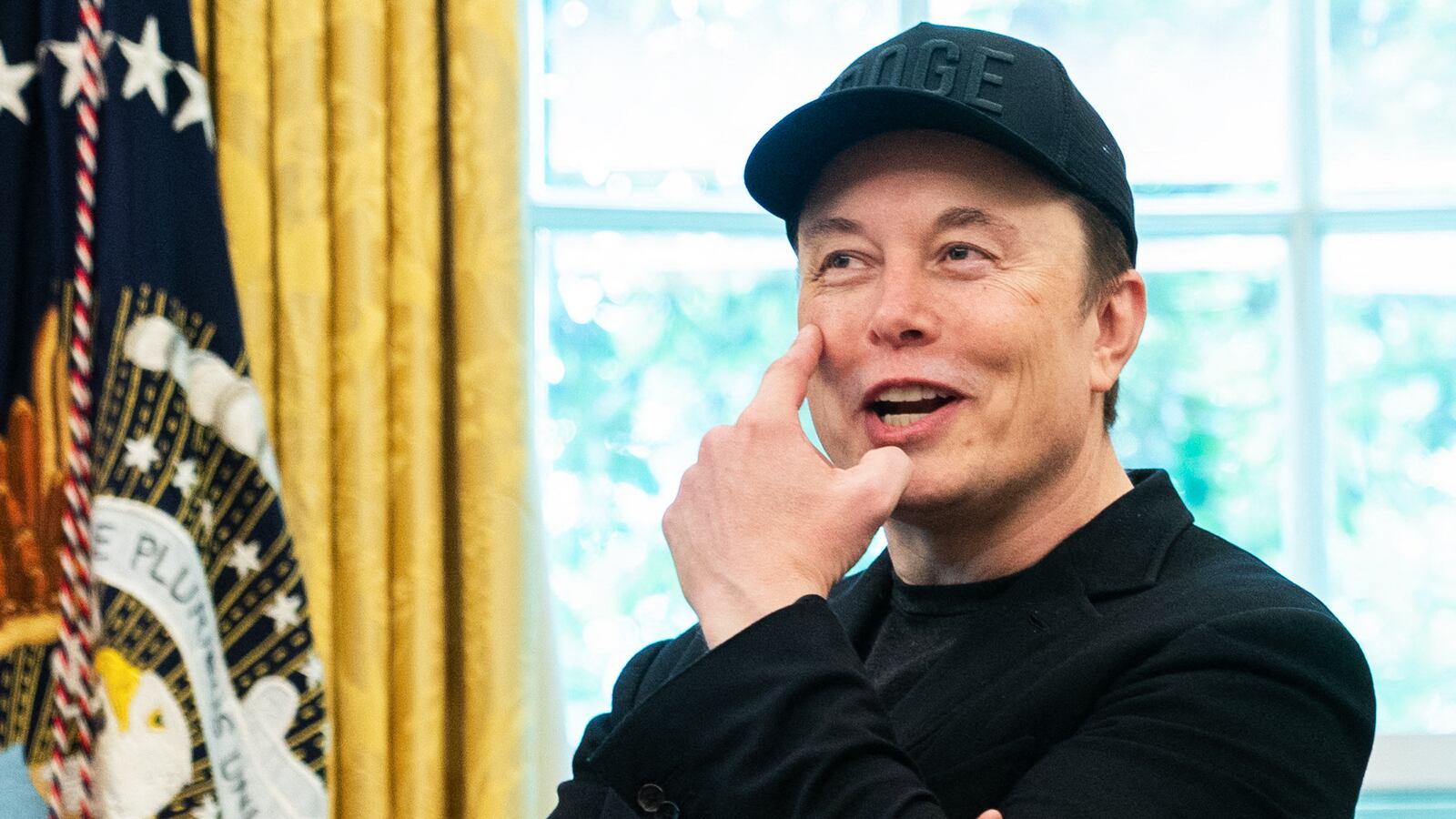 Elon Musk gestures to his eye during a news conference with US President Donald Trump in the Oval Office of the White House in Washington, DC, on May 30, 2025. Musk, who stormed into US politics as President Trump's chainsaw-brandishing sidekick, announced on May 28 that he is leaving his role in US government, intended to reduce federal spending, shortly after his first major break with the President over Trump's signature spending bill. (Photo by Allison ROBBERT / AFP) (Photo by ALLISON ROBBERT/AFP via Getty Images)