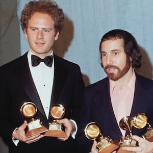 Arthur Garfunkel and Paul Simon hold a Grammy for best record and best album of the year for “Bridge Over Troubled Water” in 1971.