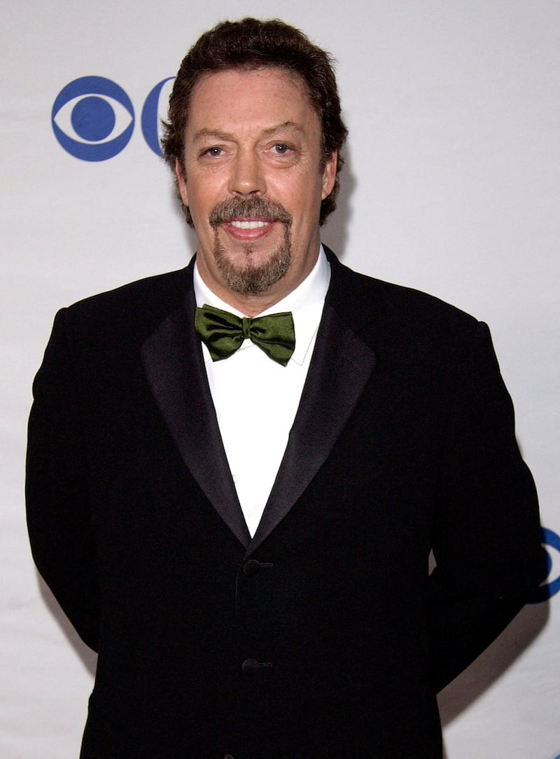 FILE PHOTO: British actor Tim Curry poses for photographers as he arrives for the American Theatre Wing's 59th Annual Tony Awards at Radio City Music Hall in New York, June 5, 2005. REUTERS/Chip East/File Photo