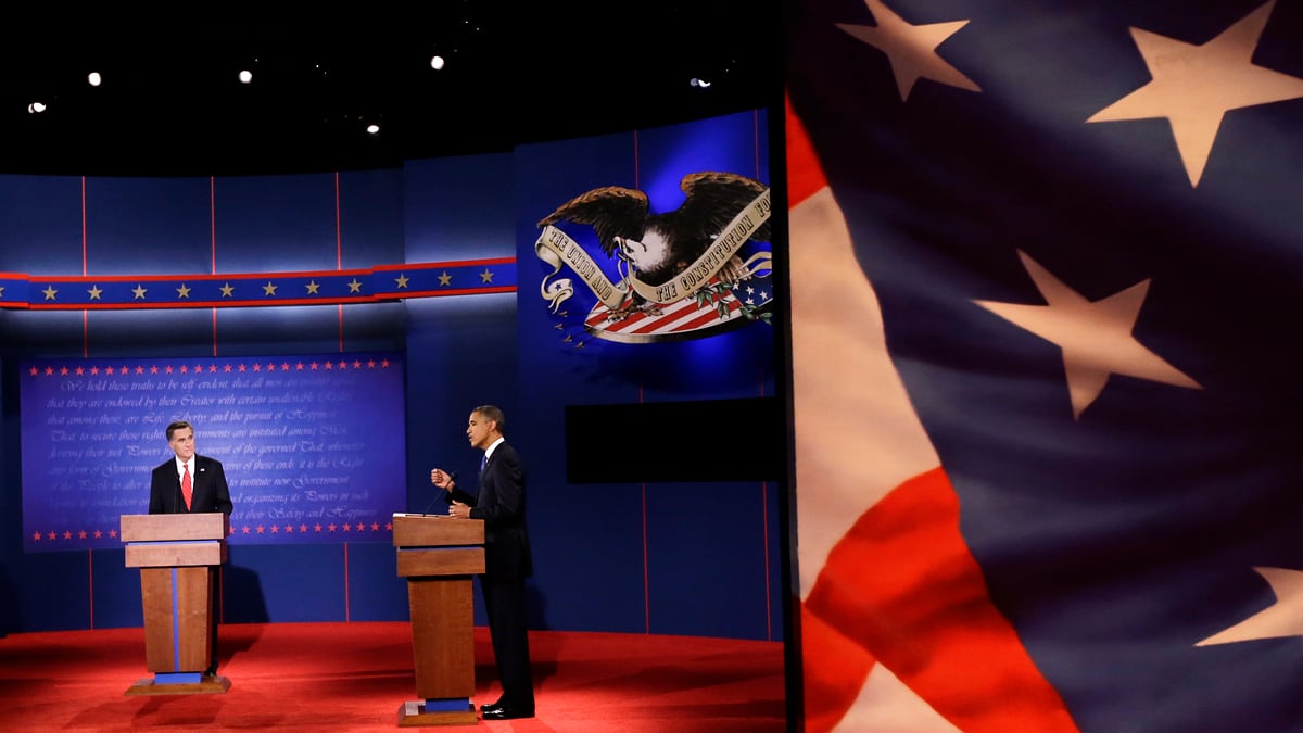 articles/2012/10/04/mitt-romney-offense-trumped-barack-obama-defense-in-presidential-debate/debate-obama-speaks-with-flag_ycnbik