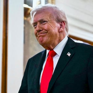 US President Donald Trump walks toward the East Room of the White House for a ballroom dinner in Washington, DC, on October 15, 2025. Trump, who is remodeling the White House to his tastes, will build a massive ballroom for hosting official receptions, one of the largest projects at the US executive mansion in over a century. (Photo by ANDREW CABALLERO-REYNOLDS / AFP)