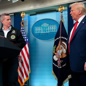 WASHINGTON, DC - JANUARY 30:  U.S. Secretary of Transportation Sean Duffy (L) takes the podium from U.S. President Donald Trump as they speak to reporters about the collision of an American Airlines flight with a military Black Hawk helicopter near Ronald Reagan National Airport, in the Brady Press Briefing Room at the White House on January 30, 2025 in Washington, DC. Officials believe that all 64 people on the commercial jet and the three service members on the U.S. Army helicopter died when they collided midair and crashed into the Potomac River airport outside Washington, D.C. on Wednesday. (Photo by Chip Somodevilla/Getty Images)