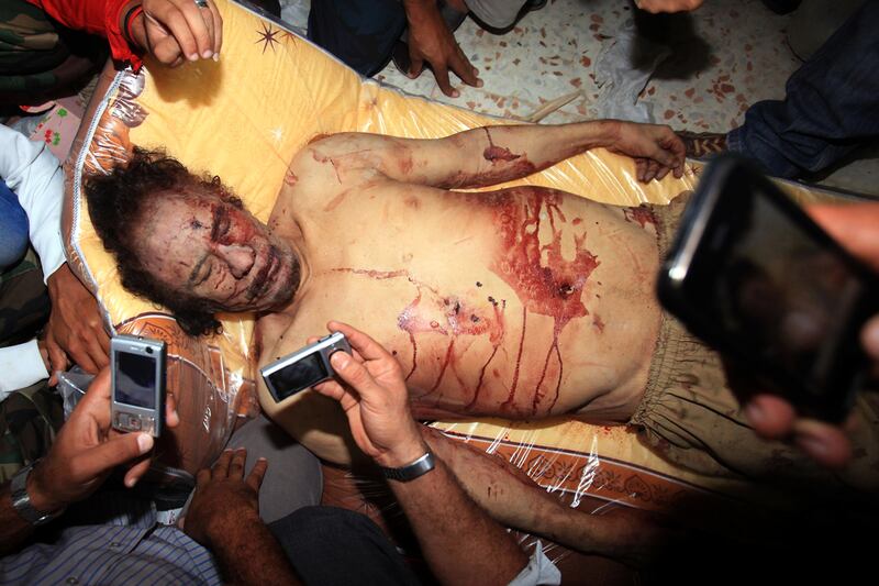galleries/2012/04/19/controversial-photos-u-s-soldiers-with-taliban-bodies-whitney-houstons-death-and-more/controvesial-photos-gaddafi_po2tjt