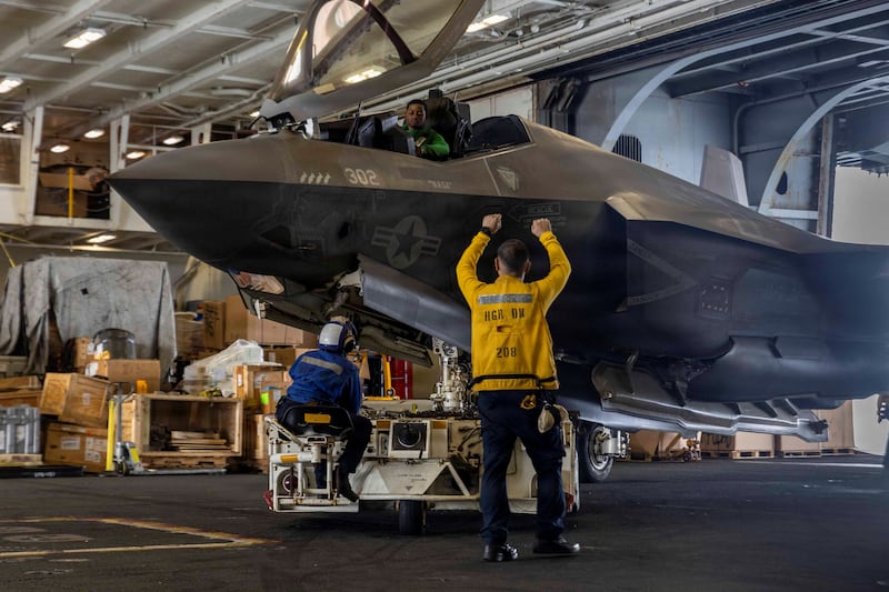 U.S. Navy sailors taxi a U.S. Marines F-35C Lightning II jet in the hangar bay aboard Nimitz-class aircraft carrier USS Abraham Lincoln during the Operation Epic Fury attack on Iran, March 29, 2026. U.S. Navy/Handout via REUTERS    THIS IMAGE HAS BEEN SUPPLIED BY A THIRD PARTY.
