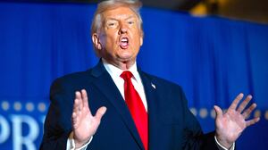 US President Donald Trump sings upon his arrival to deliver remarks on the economy at Mount Airy Casino Resort in Mount Pocono, Pennsylvania, on December 9, 2025.