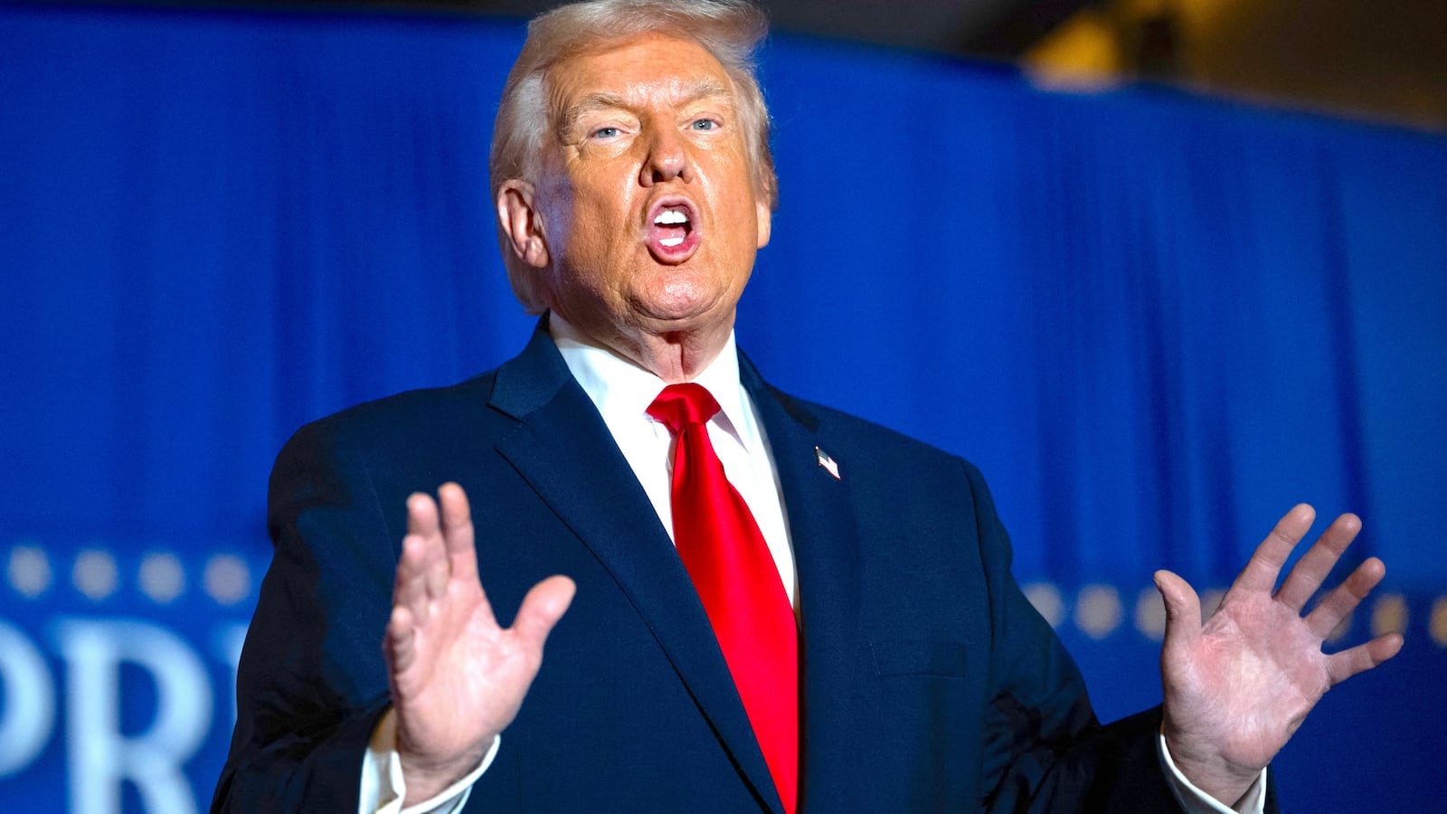 US President Donald Trump sings upon his arrival to deliver remarks on the economy at Mount Airy Casino Resort in Mount Pocono, Pennsylvania, on December 9, 2025.