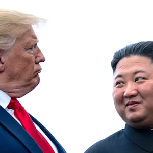 US President Donald Trump and North Korea's leader Kim Jong-un talk before a meeting in the Demilitarized Zone (DMZ)