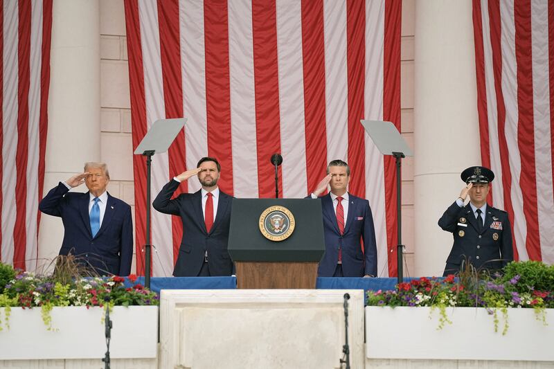 U.S. President Donald Trump, Vice President JD Vance and Defense Secretary Pete Hegseth salute as they attend the annual National Memorial Day Observance in the Memorial Amphitheater at Arlington National Cemetery in Arlington, Virginia, U.S., May 26, 2025. REUTERS/Ken Cedeno