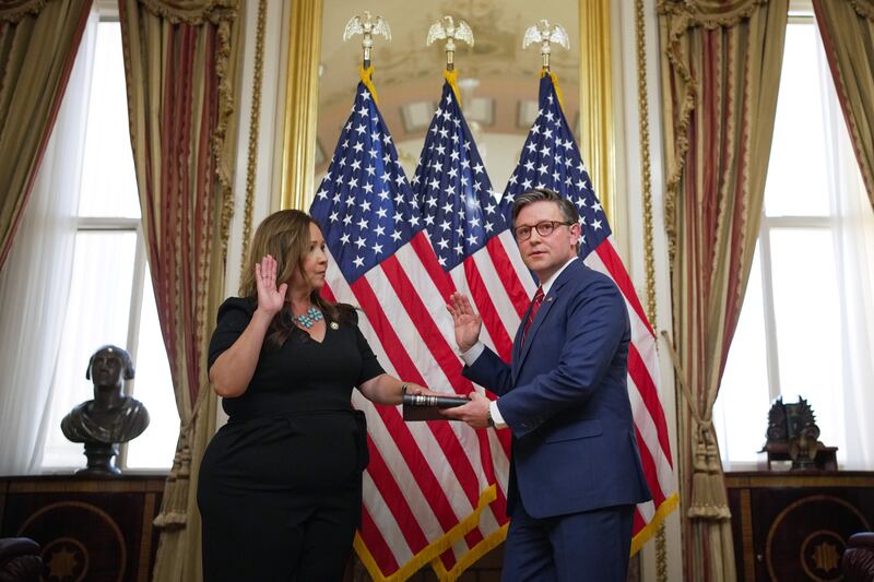 U.S. Rep. Adelita Grijalva (D-AZ) and Speaker of the House Mike Johnson (R-LA) participate in a ceremonial swearing-in at the U.S. Capitol Building on November 12, 2025 in Washington, DC.