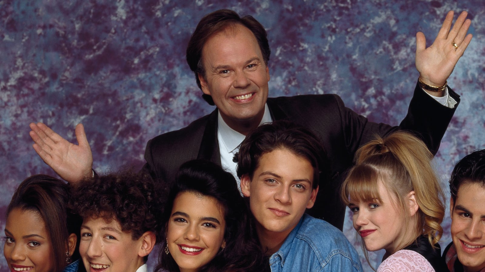SAVED BY THE BELL - THE NEW CLASS -- Season 1 -- Pictured: (l-r) Bianca Lawson as Megan Jones, Isaac Lidsky as Barton 'Weasel' Wyzell, Natalia Cigliuti as Lindsay Warner, Robert Sutherland Telfer as Scott Erickson, Bonnie Russavage as Vicki Needleman, Jonathan Angel as Tommy 'D' De Luca, (Back) Dennis Haskins as Principal Richard Belding (Photo by Paul Drinkwater/NBCU Photo Bank/NBCUniversal via Getty Images via Getty Images)