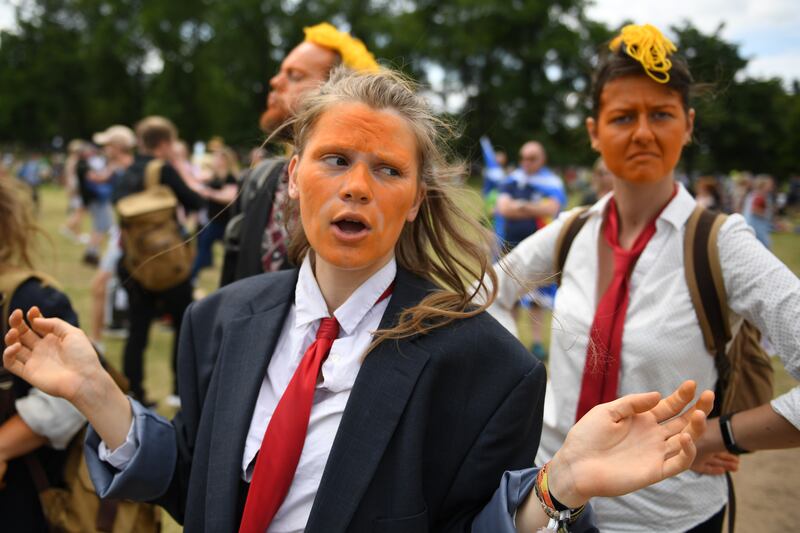 Protesters wore orange face makeup.