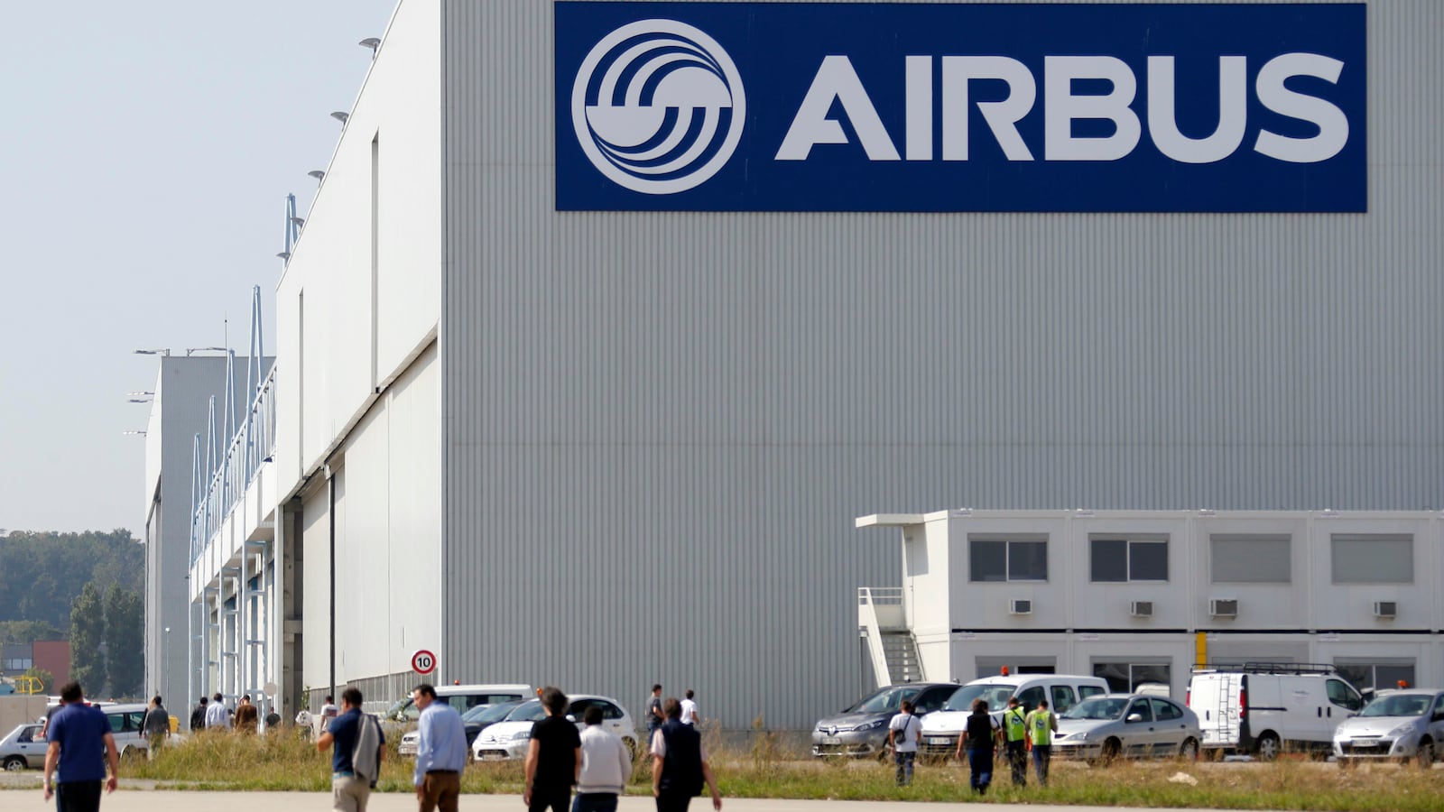 Airbus staff walking near building.