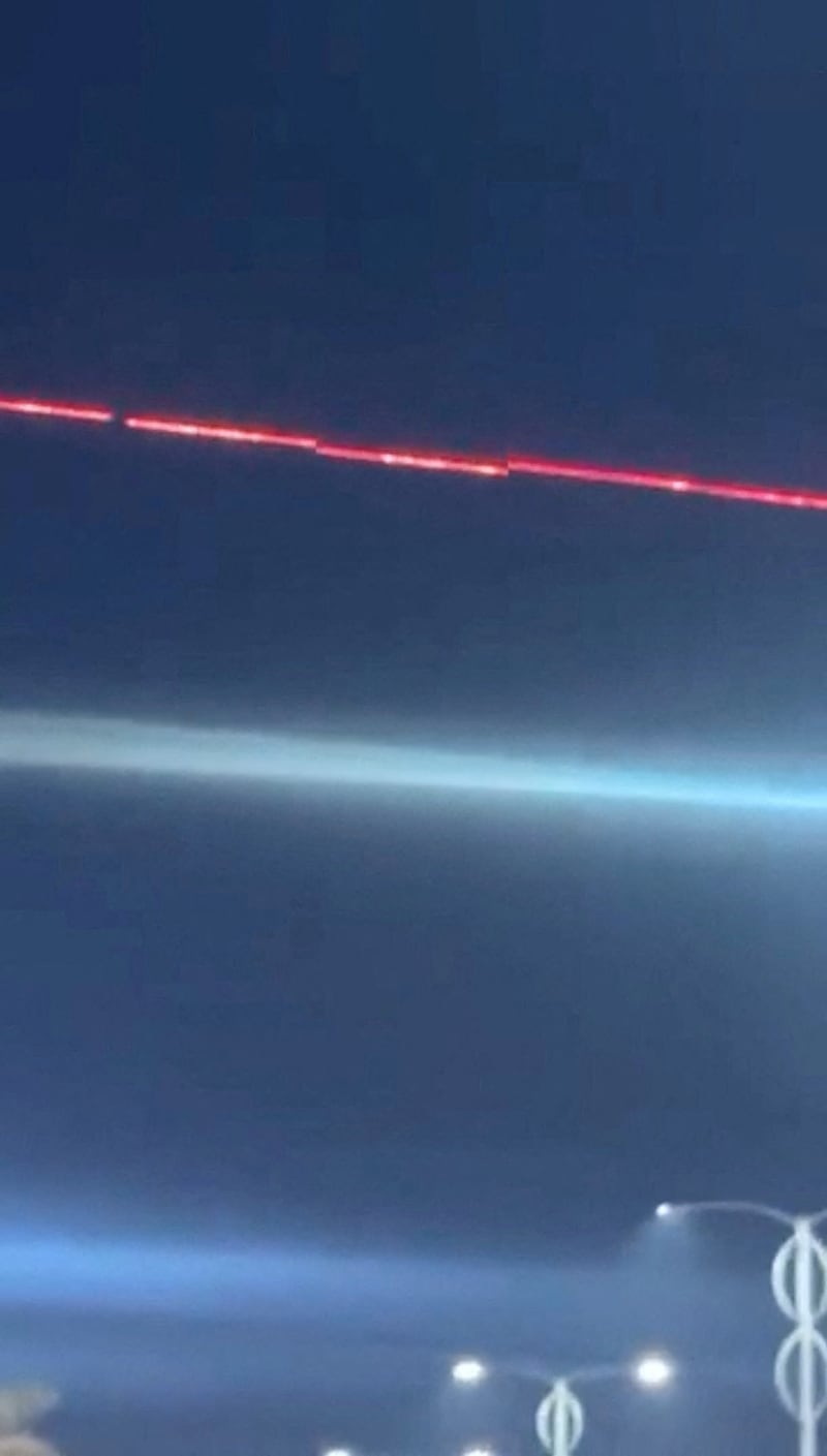 A C-RAM air defence system intercepts drones during reported drone and rocket attacks on the U.S. embassy, according to Iraqi security sources, in Baghdad, Iraq, in this still image obtained from a social media video released on March 17, 2026. Social Media via REUTERS  THIS IMAGE HAS BEEN SUPPLIED BY A THIRD PARTY. NO RESALES. NO ARCHIVES. NEWS USE ONLY.   VERIFICATION: Reuters was able to confirm the location from the shape of the building, road layout, street lights and vegetation.  Exact time could not be verified but no older version of the video was found posted online before March 17.  Iraqi security sources confirmed that rockets and at least five drones were launched at the U.S. embassy in Baghdad early on Tuesday.  The direction of the C-RAM air defence system was seen moving towards the opposite side of the embassy. Earlier, a Reuters witness confirmed seeing at least three drones heading in the direction of the embassy. Coordinates of the building under attack are 33.29164731525183, 44.390272740582226