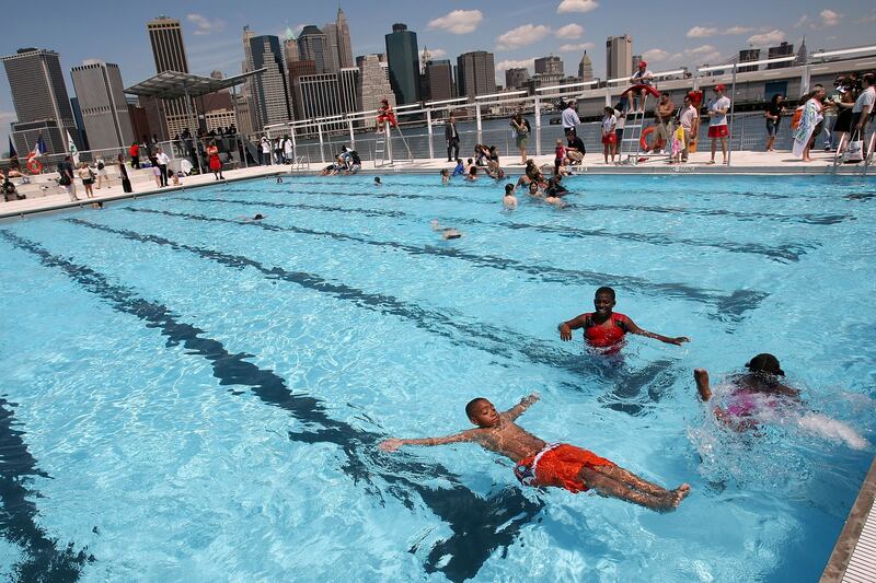 galleries/2013/05/25/vintage-summer-in-new-york-the-sweet-sweaty-city-life/130524-nyc-swim-floating_enum9x