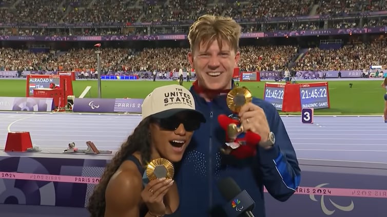 Tara Davis-Woodhall and Hunter Woodhall show off their matching gold medals at the 2024 Paralymic Games in Paris on September 6, 2024.