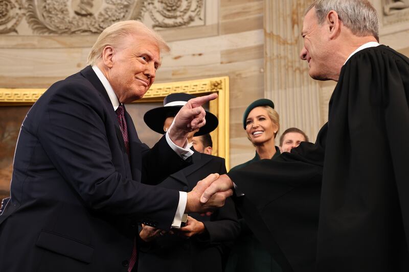 President Donald Trump gestures to U.S. Supreme Court Chief Justice John Roberts after he was sworn in during inauguration ceremonies in the Rotunda of the U.S. Capitol on January 20, 2025 in Washington/