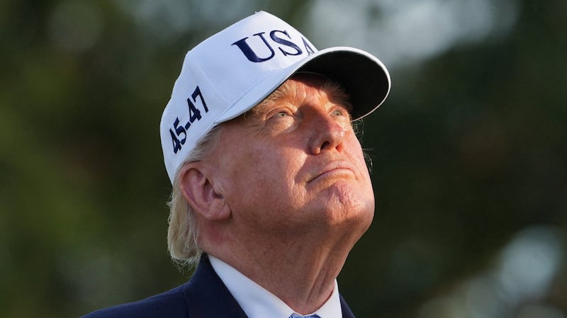US President Donald Trump looks on as he attends the Presidents Cup golf tournament at Medinah Country Club, in Medinah Illinois, US, September 27, 2026. REUTERS/Nathan Howard