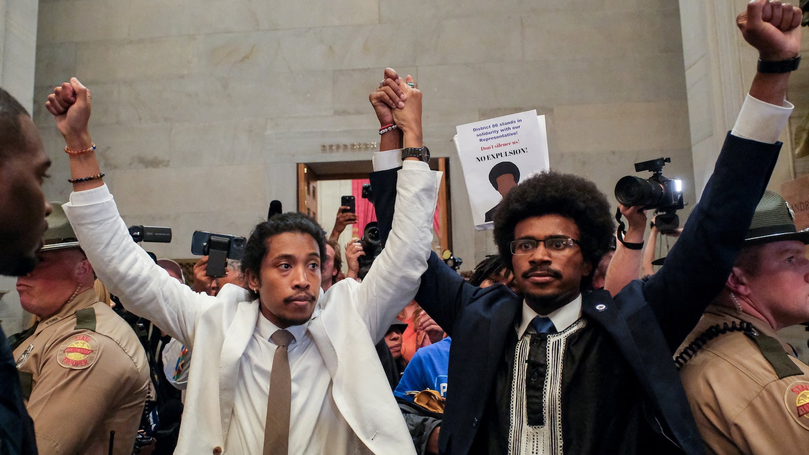Justin Pearson and Justin Jones raise their hands after being expelled from their seats in Nashville, Tennessee, U.S., April 6, 2023.