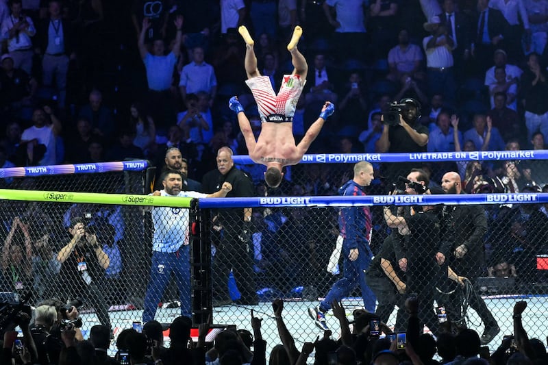 America's Justin Gaethje celebrates after defeating Ilia Topuria during "UFC Freedom 250" mixed martial arts event on the South Lawn of the White House in Washington, DC, in the early morning hours of June 15, 2026.