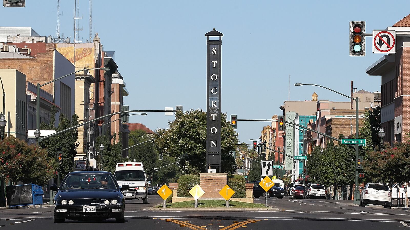 STOCKTON, CA - JUNE 27: Cars drive by a sign on June 27, 2012 in Stockton, California. Members of the Stockton city council voted 6-1 on Tuesday to adopt a spending plan for operating under Chapter 9 bankruptcy protection following failed talks with bondholders and labor unions failed. The move will make Stockton the biggest U.S. city to file for bankruptcy protection from creditors.
