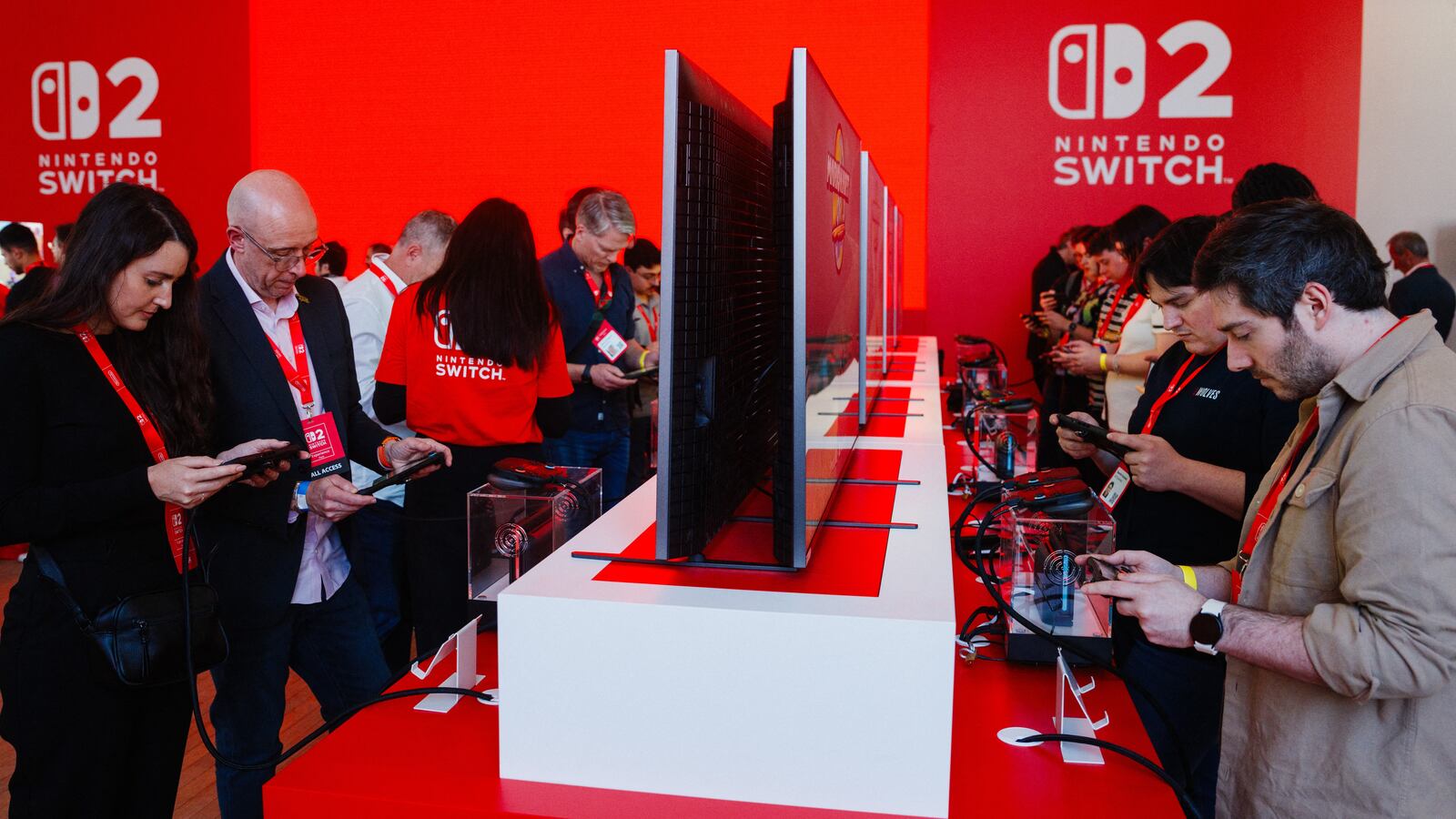Guests play with the new Nintendo Switch 2 video-game console system of Japanese video-game company Nintendo during the worldwide presentation at the Grand Palais in Paris on April 2, 2025.