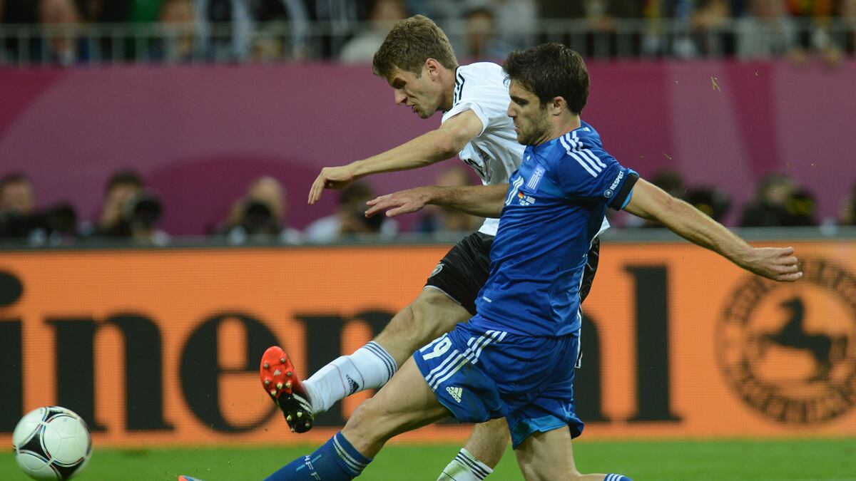 articles/2012/06/22/soccer-diplomacy-merkel-greece-near-critical-final-round-on-debt/germany-greece-soccer-nadeau_vrvr55