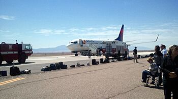 cheats/2011/05/09/man-tries-to-open-plane-door-mid-flight/delta-flight-diverted_osoznk