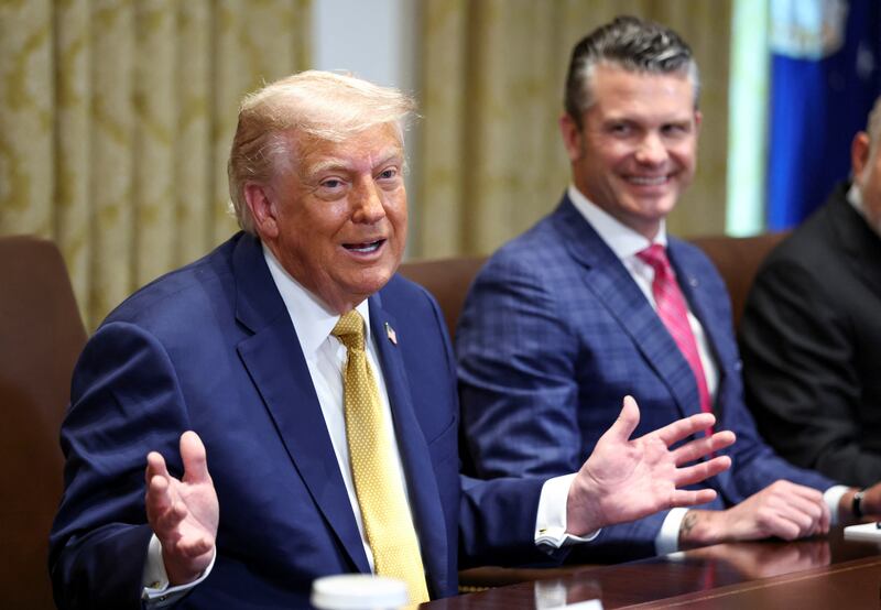 U.S. President Donald Trump speaks next to Defense Secretary Pete Hegseth during a cabinet meeting at the White House in Washington, D.C., U.S., July 8, 2025.   REUTERS/Kevin Lamarque