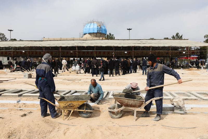 People work on graves for victims of Israeli and U.S. strikes, amid the U.S.-Israeli conflict with Iran, in Tehran, Iran, March 9, 2026. Majid Asgaripour/WANA (West Asia News Agency) via REUTERS ATTENTION EDITORS - THIS PICTURE WAS PROVIDED BY A THIRD PARTY
