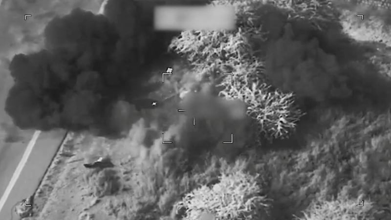Smoke rises from a blast at an unknown location, during what the U.S. says are strikes on Iran.