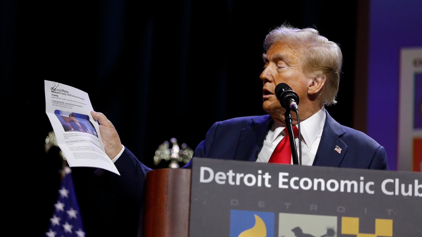 Trump read out a newspaper story saying he was once made Man of the Year in Michigan but the story was corrected.