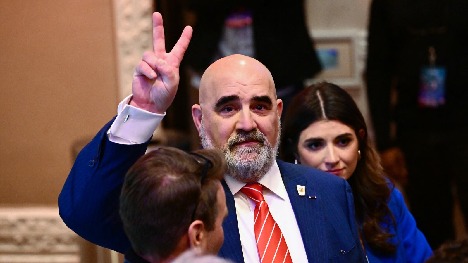 Chris LaCivita flashing a v-sign